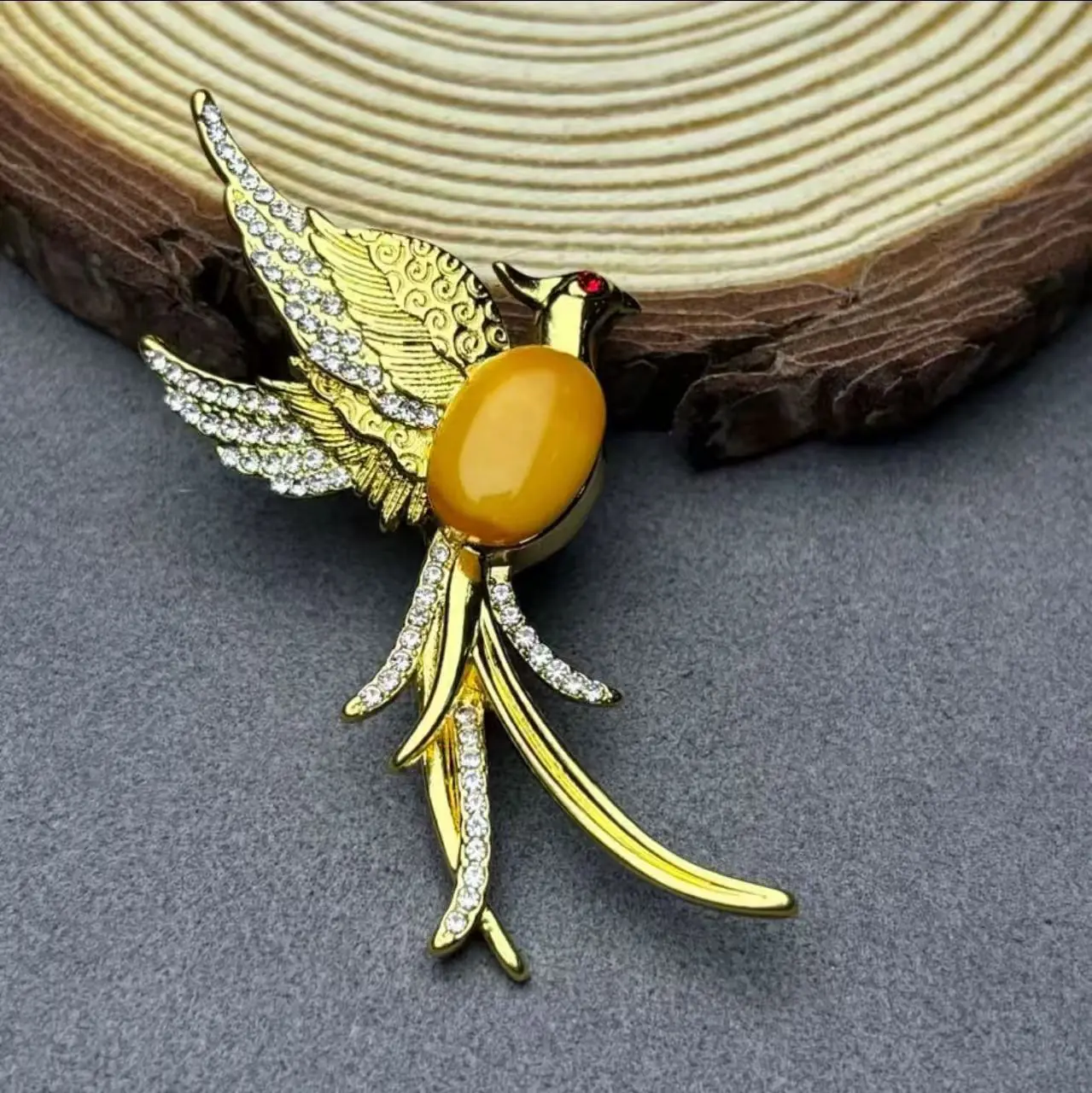 Koperlegering Barnsteen Phoenix-Broche